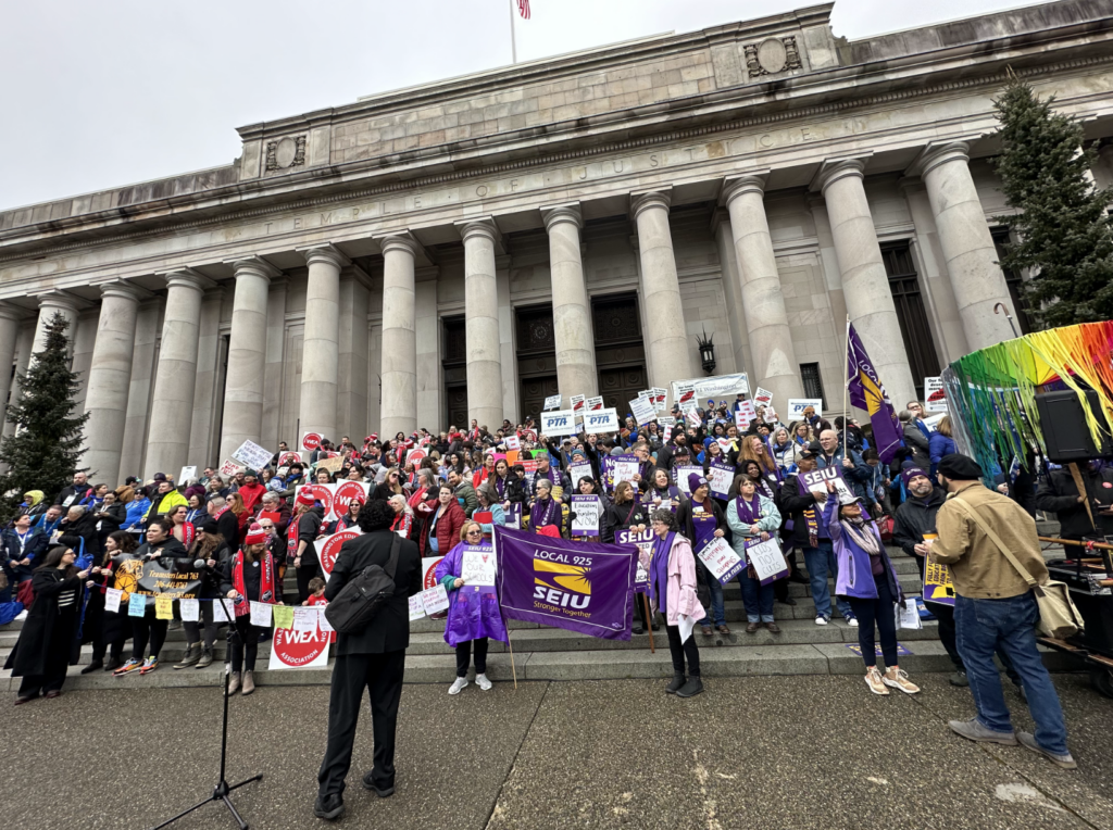 A colorful crowd of advocates from PTA, SEIU, WEA and more gather on the stairs of the Temple of Justice on the Washington State Capitol campus in Olympia on Feb. 17, 2025